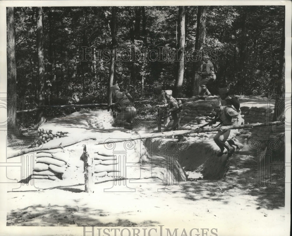 1941 Armored Force soldiers cross an obstacle course in training - Historic Images