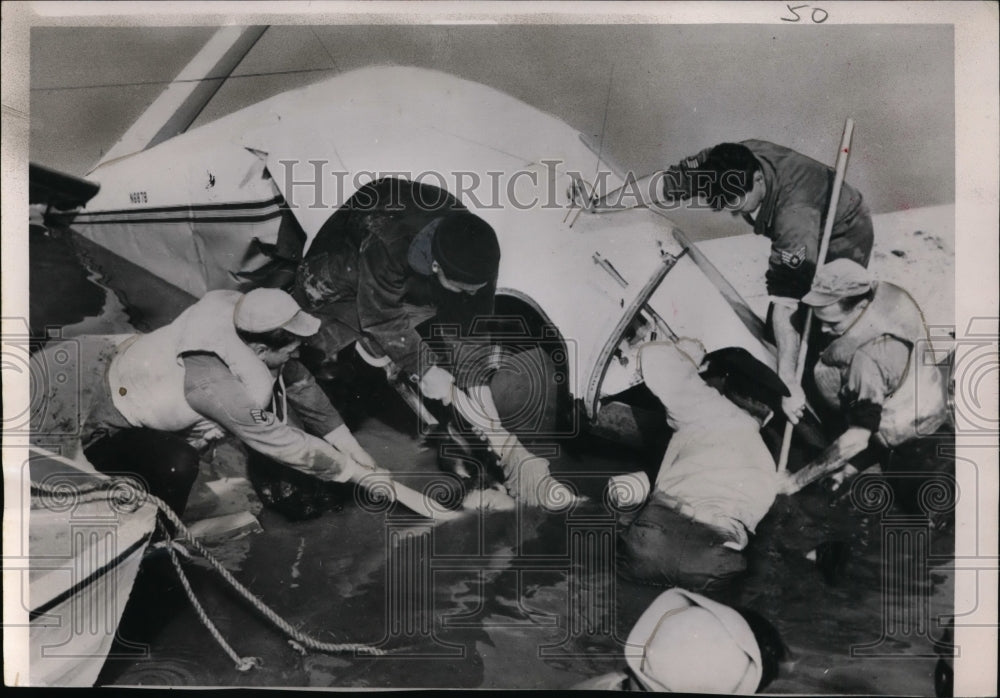 1951 Press Photo Bolling Air Base rescuers helps a victim from a plane crash-Historic Images