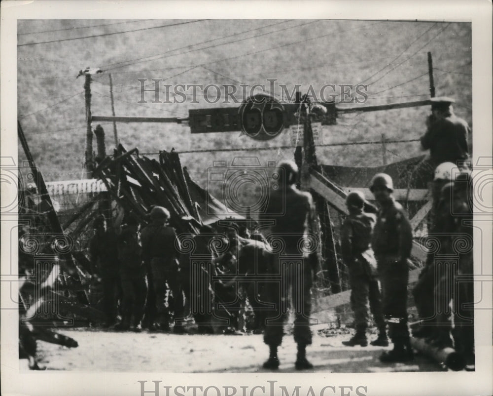 1952 British Troops ripping down a building in Koje Island, Korea - Historic Images