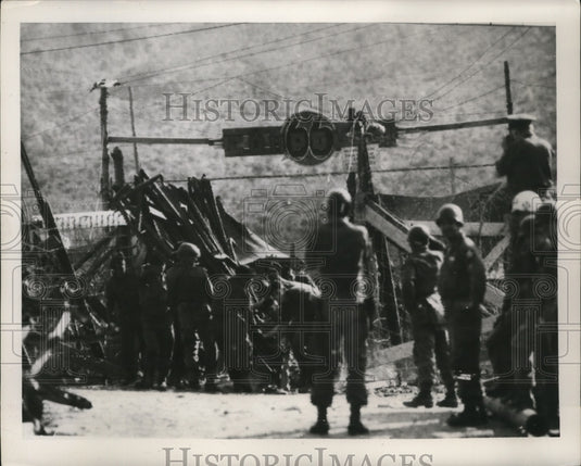 1952 British Troops ripping down a building in Koje Island, Korea - Historic Images