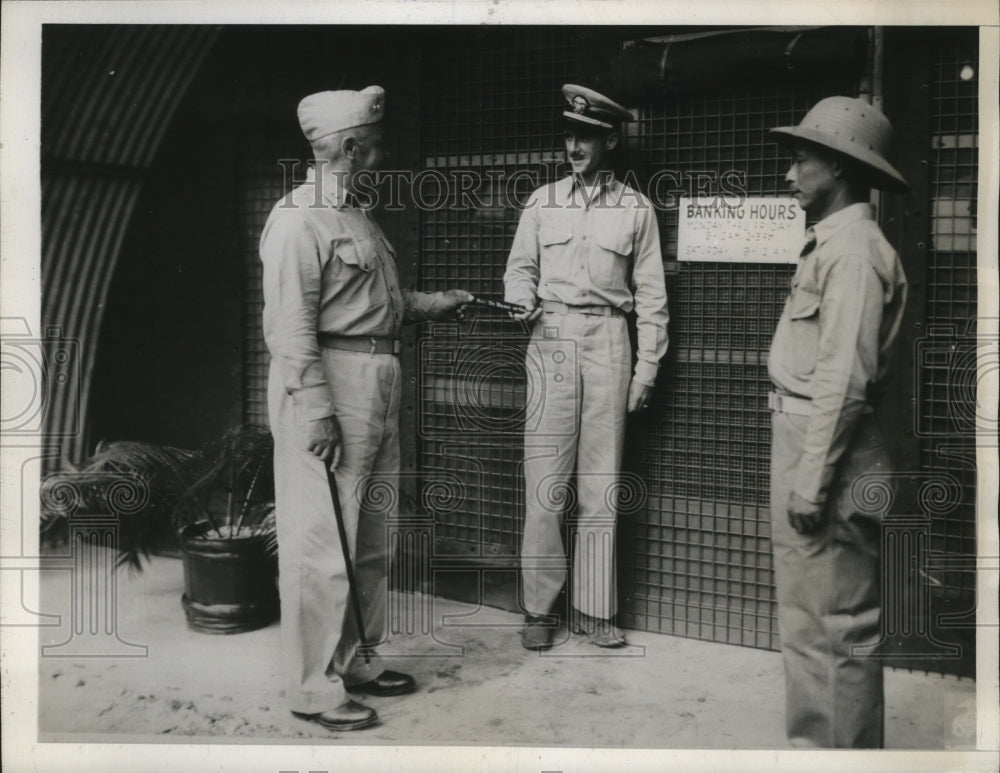 1945 Maj Gen Henry Larsen presents bank key to WB Willard - Historic Images