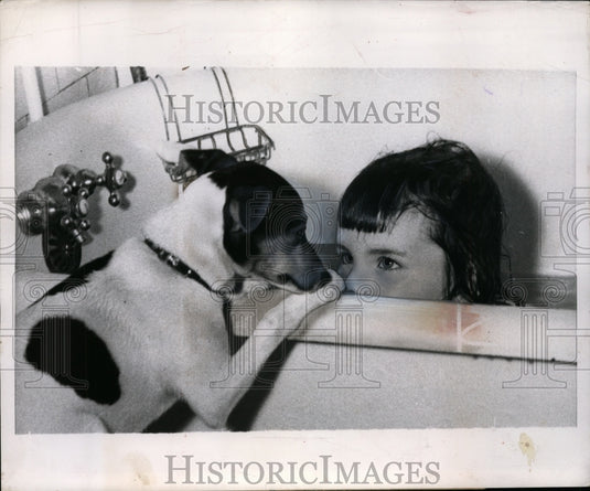 1953 Little Julie Ann O'Brien with her fox terrier "Trixie" - Historic Images