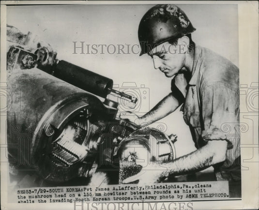1950 Private James A. Lafferty cleans the Howitzer in Korean Camp - Historic Images