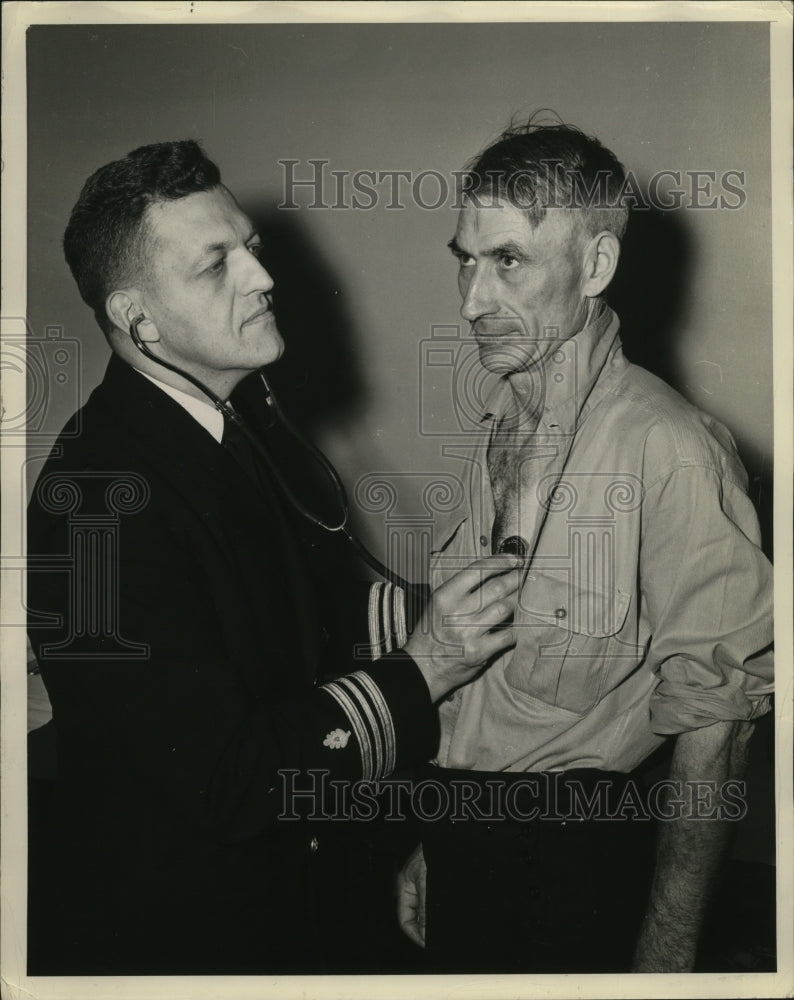 1941 Floyd Patton of U.S Navy is examined by Dr. Roger Holcomb - Historic Images