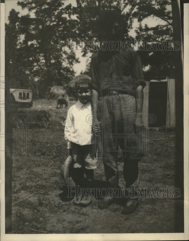 1942 Jimmy Noh pictured holding his hat and a man - Historic Images