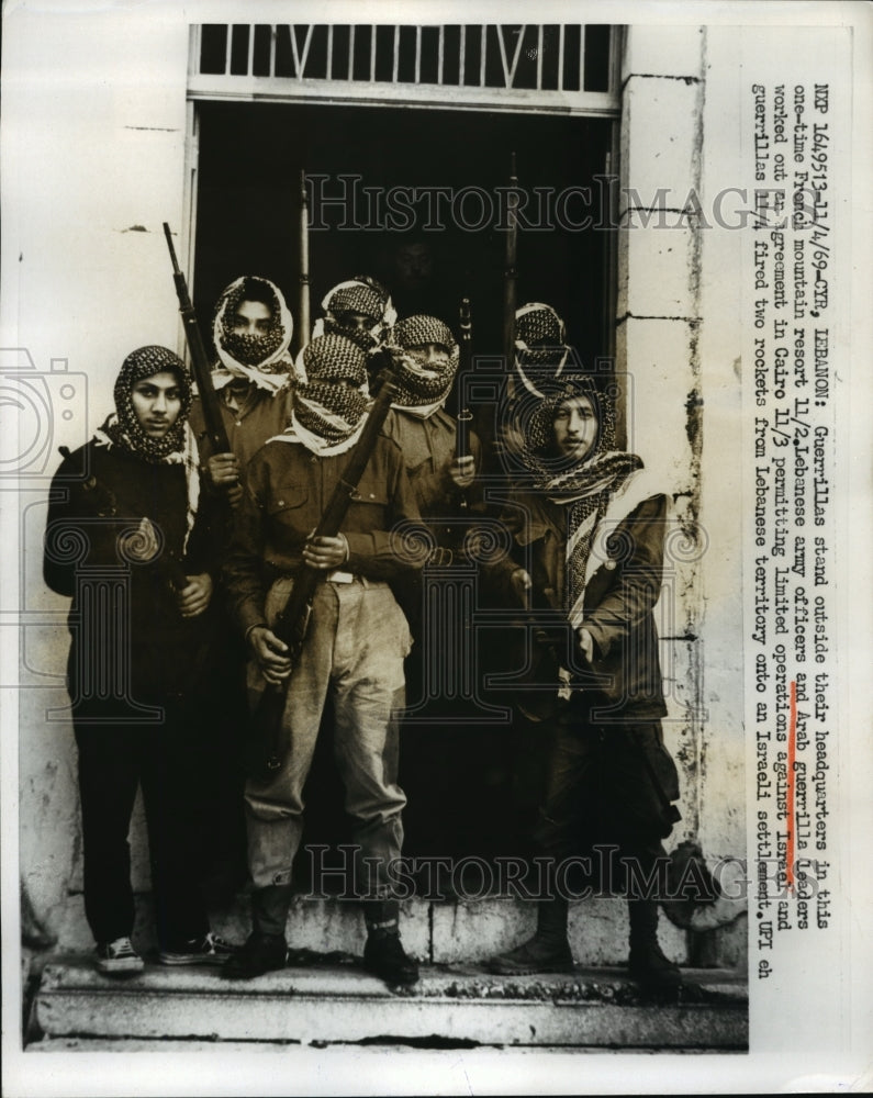 1969 Group of Arab guerillas standing outside the headquarters - Historic Images