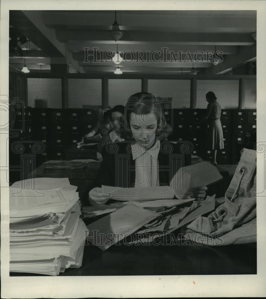1940 Red Cross worker sorts inquiries received at Inquiry Service - Historic Images
