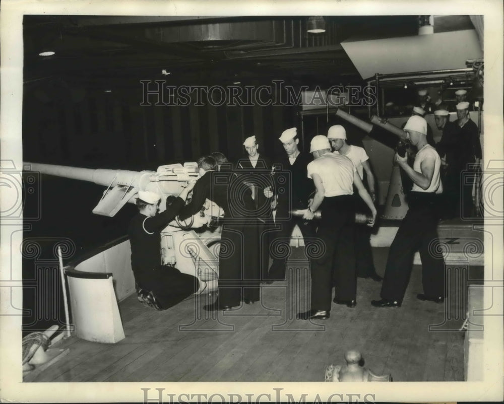 1941 Three broadside gun crew during training aboard an indoor ship - Historic Images