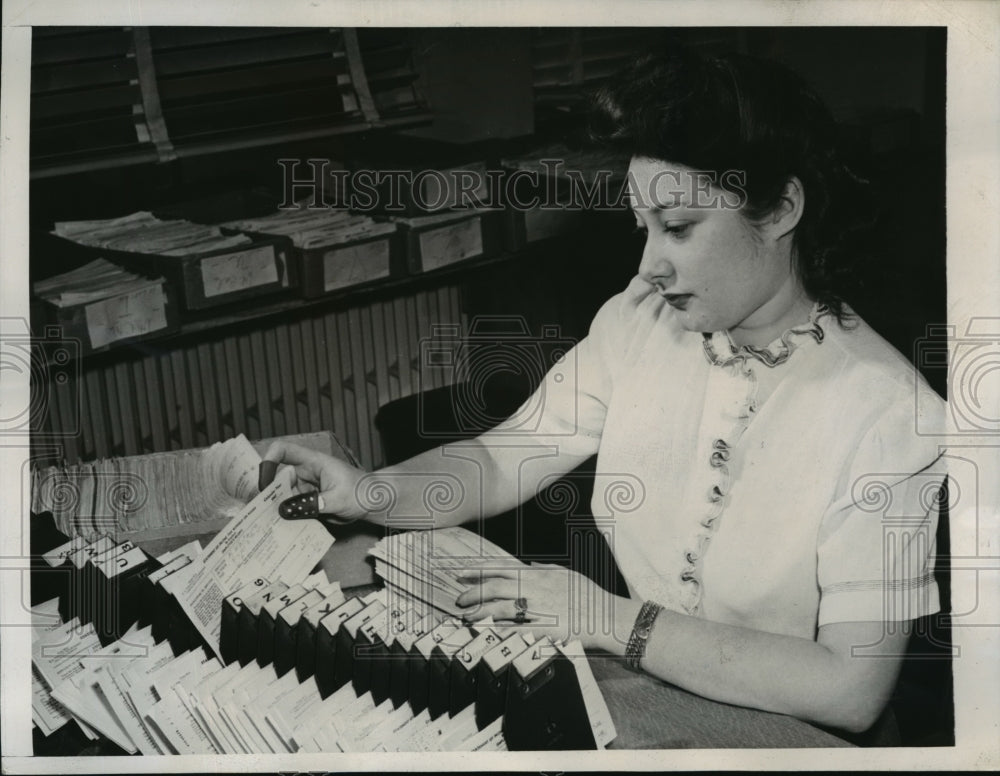 1944 New York Mildren Rosenaw sorts through tax returns NYC - Historic Images