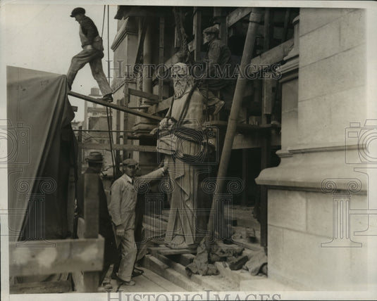 1932 Press Photo New York Statue of St Andrews Hoisted to Top of Cathedral NYC - Historic Images