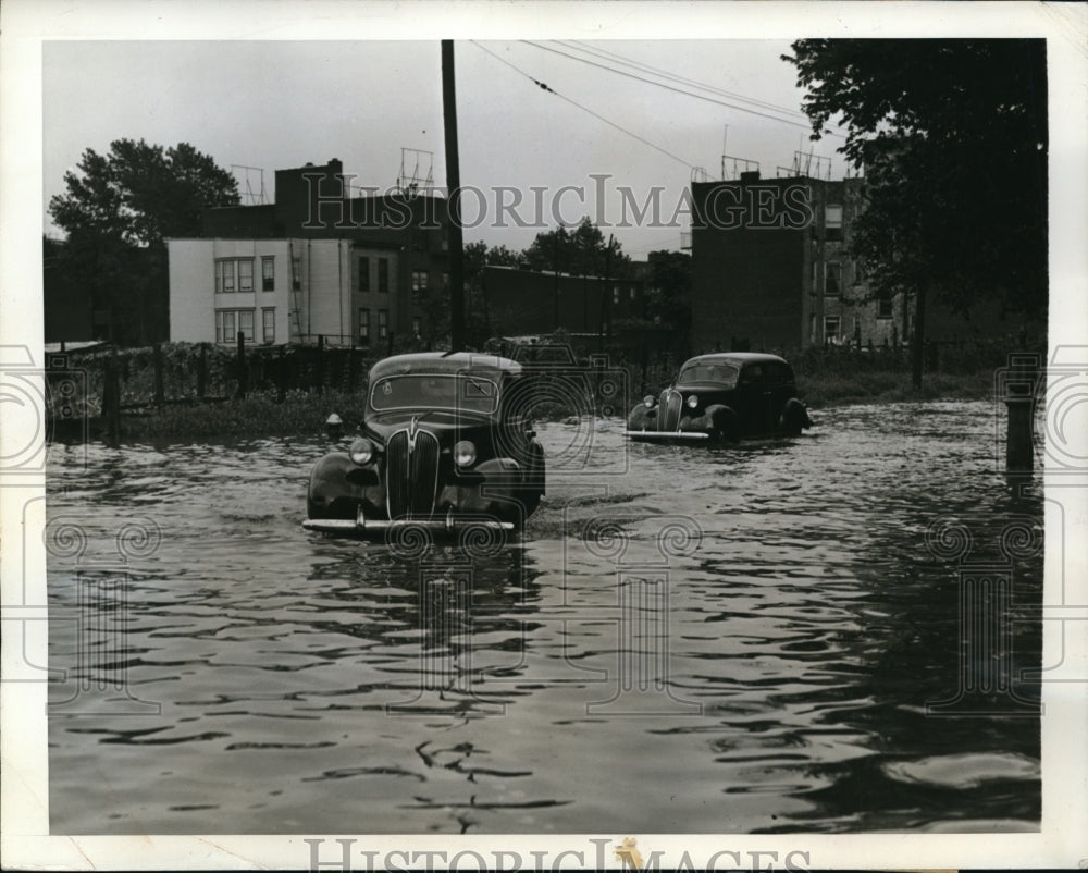 1942 Press Photo New York rains cause streets to flood  in Astoria, Queens NYC - Historic Images