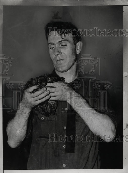 1935 Press Photo Terrence White with Bulldog Puppies Rescued from Sewer New York - Historic Images