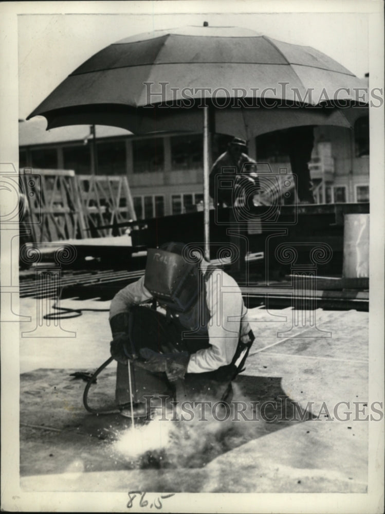 1942 Welder Under Umbrella, California Shipbuilding Corporation - Historic Images