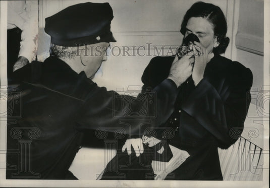 1952 Dorothea Langel aided by Robert King after train caught fire - Historic Images