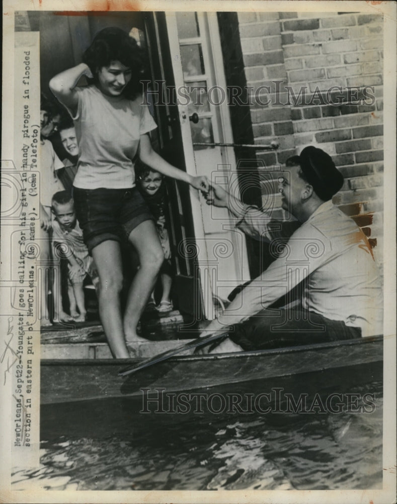 1947 Press Photo Girl Rescued from Flood in Pirougue, New Orleans, Louisiana-Historic Images