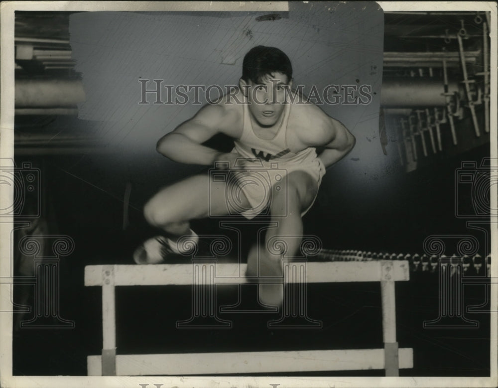 1941 Press Photo Bob Ralls West High track hurdler in action - Historic Images