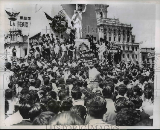 1958 Press Photo Demonstrators knocking down a floral display - nep03938-Historic Images