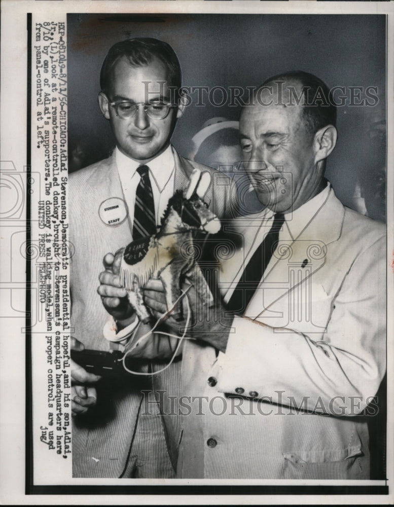 1956 Press Photo Adlai Stevenson & Son, Adlai Stevenson Jr. Looking at RC Donkey-Historic Images