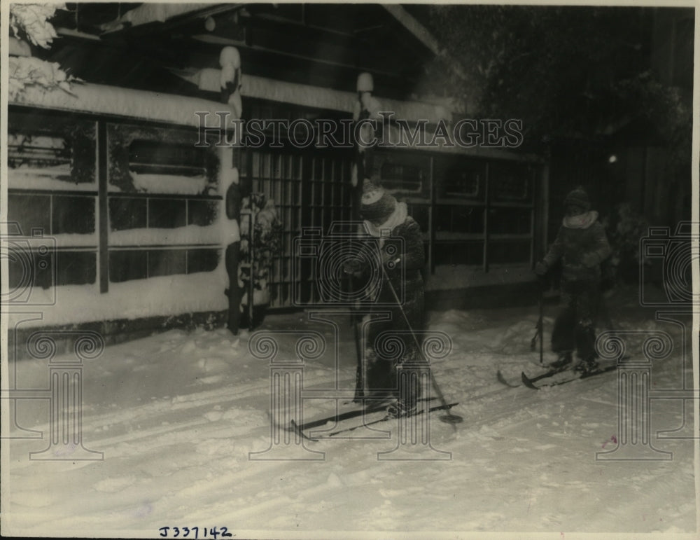 1936 Young Japanese kids trying out new skis in Tokyo, Japan - Historic Images