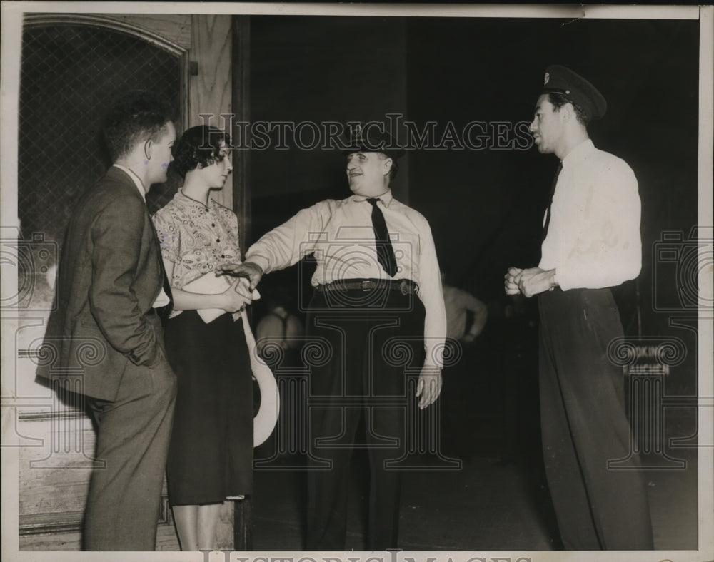 1937 Press Photo Patrolmen talking to two civilians at New York City harbor - Historic Images