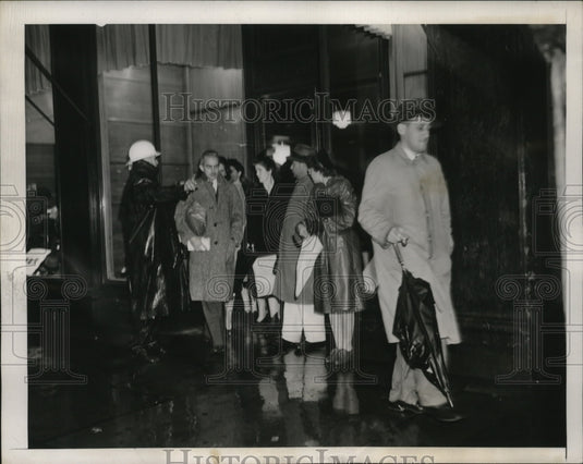 1943 Policeman directs pedestrians to safety during air raid alert - Historic Images