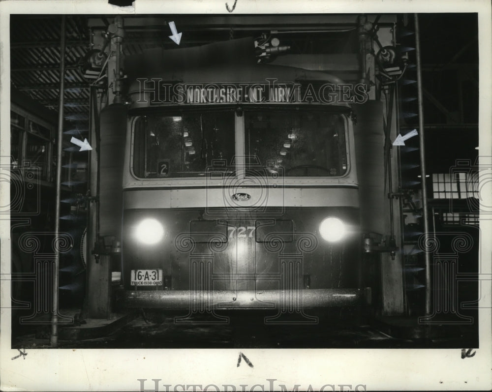 1938 Press Photo Bus with headlights on in a New York City bus terminal - Historic Images