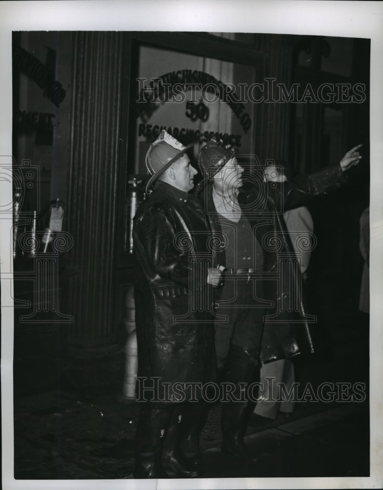 1950 Press Photo New York Two firemen watch fire on Murray Street - nera09018 - Historic Images