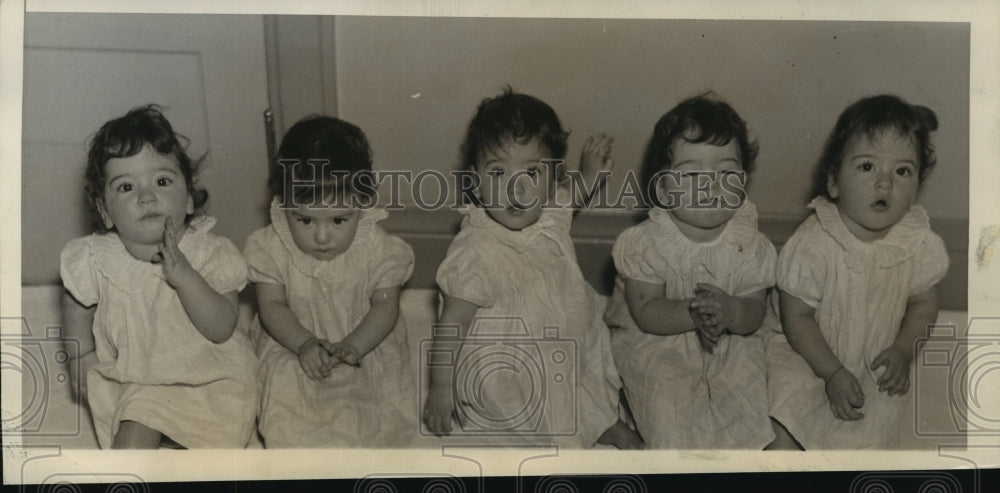 1935 Press Photo Dionne Quintuplets wear white dresses - nera11652 - Historic Images