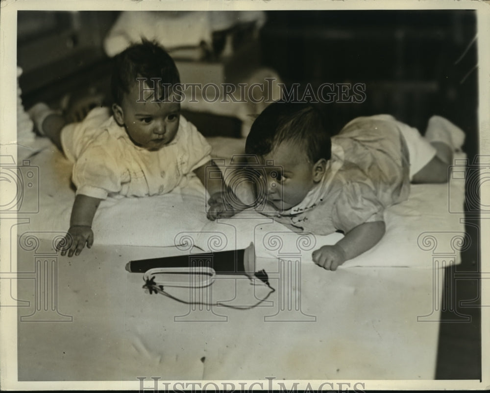 1935 Press Photo Annette fascinated by a tin trumpet - nera11666-Historic Images