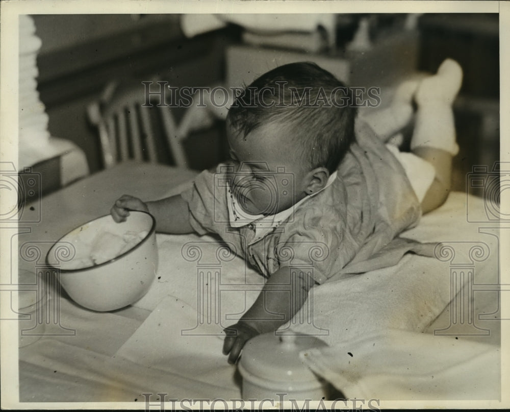 1935 Cecile checks out a bowl  - Historic Images