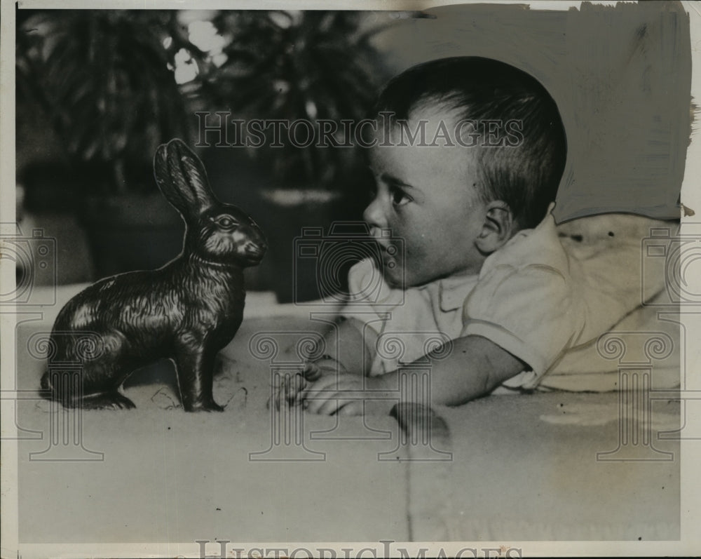 1935 Press Photo Marie looks at chocolate Easter bunny - nera11737 - Historic Images