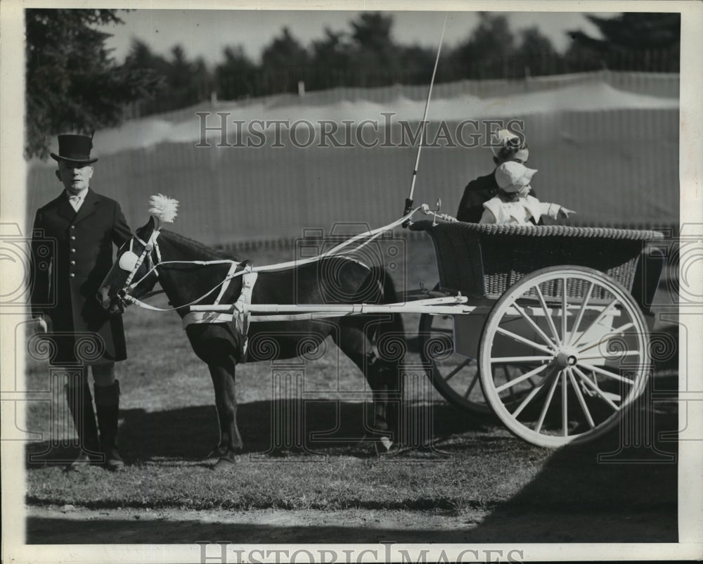 1936 Emilie and Nurse Leroux ride in pony cart  - Historic Images