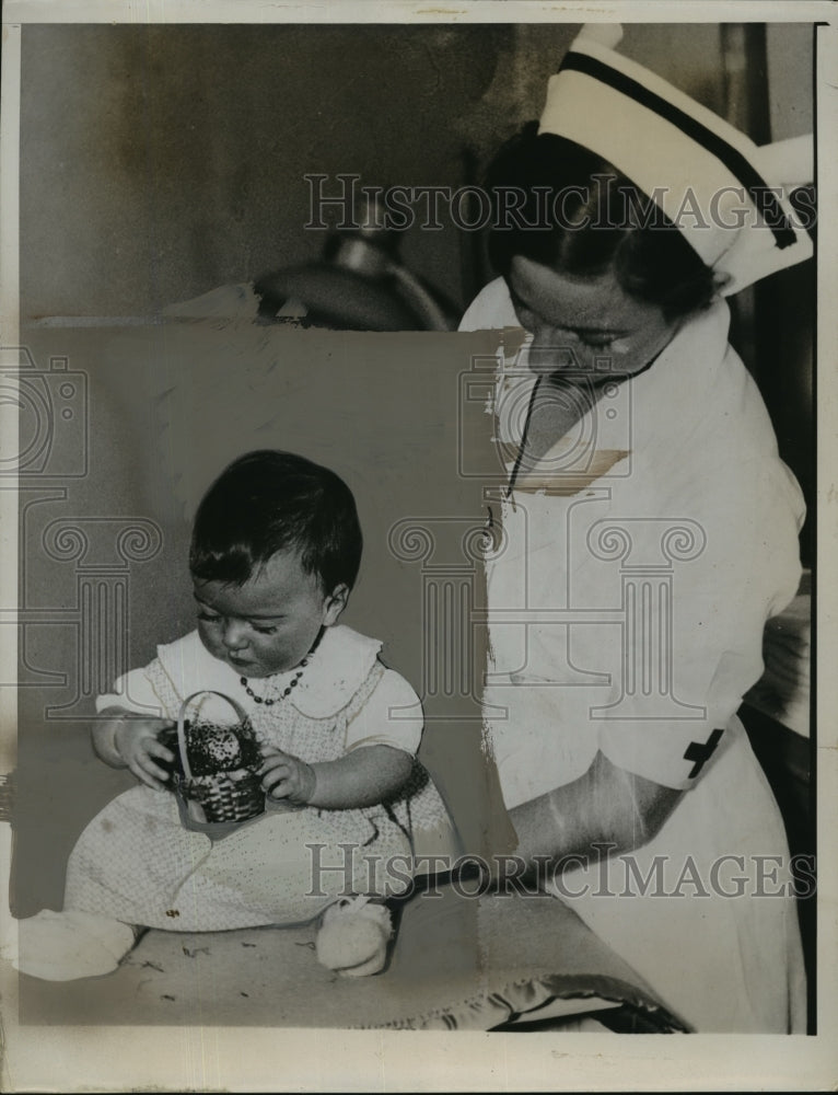 1935 Press Photo Annette looks at her first Easter basket - nera11829-Historic Images