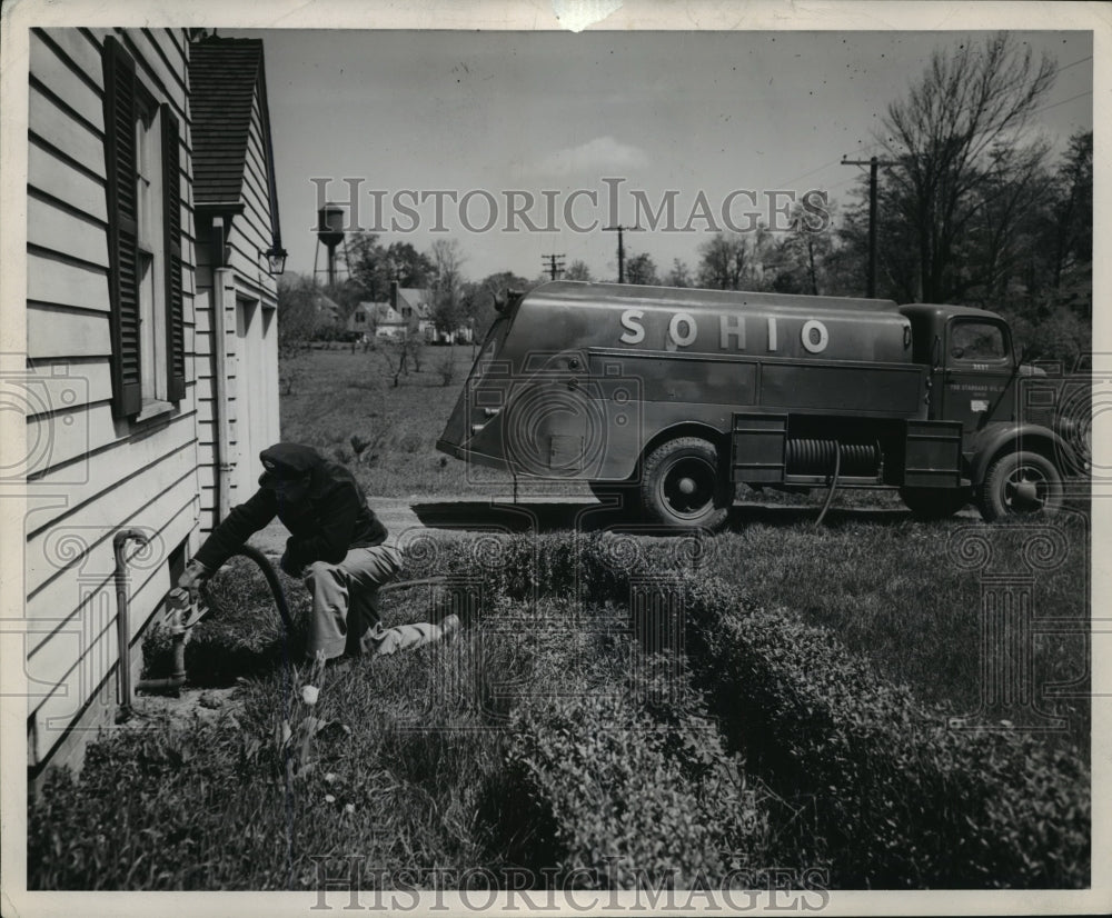 Press Photo Cleveland Oil tanker bunkers a private home, by Ewing Galloway - Historic Images