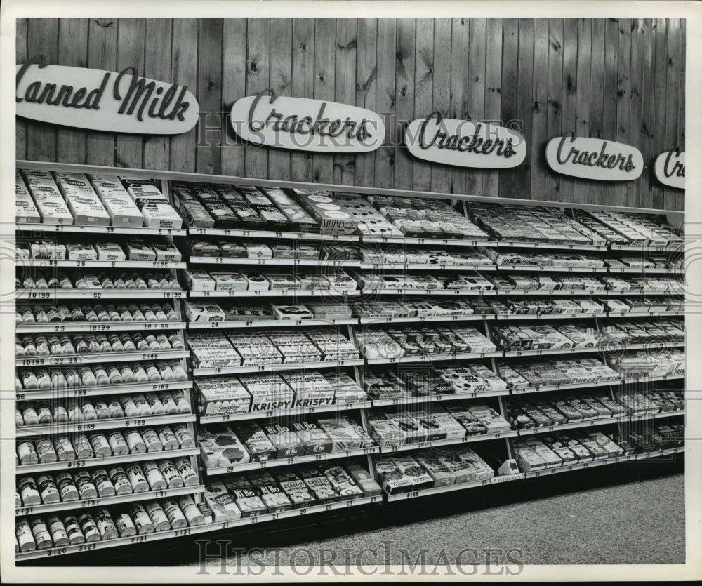 Press Photo Canned milk and crackers display at grocery store - Historic Images