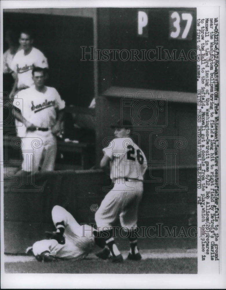 1960 Press Photo Pete Whisenan falls to ground, Bob Allison, 26, throws the ball - Historic Images