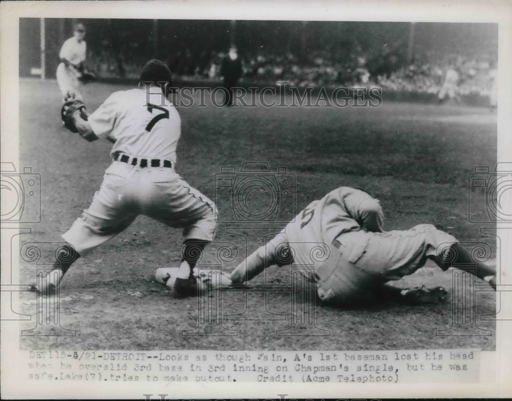 1948 Press Photo Athlerics 1st baseman is safe in 3rd base in Chapman's single. - Historic Images