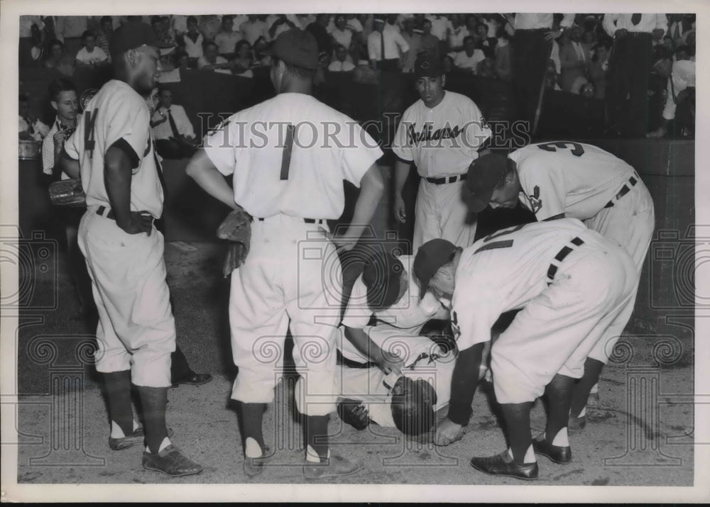 1952 Press Photo Dave Pope of Indians Lies On Ground After Hitting Wall, L. Doby - Historic Images