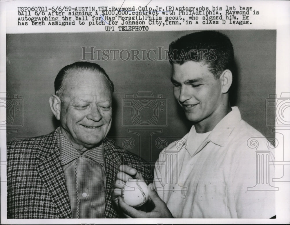 1959 Press Photo Raymond Culp, Jr. Autographs 1st Ball After $100,000 Contract - Historic Images
