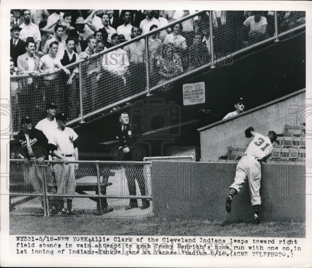 1949 Press Photo Allie Clark Indians Leaps At Home Run Ball Hit By Tommy Henrich - Historic Images
