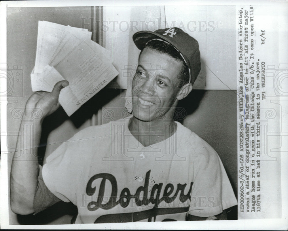 1961 Press Photo Maury Wills gets congrats telegrams for home run vs Cubs- Historic Images