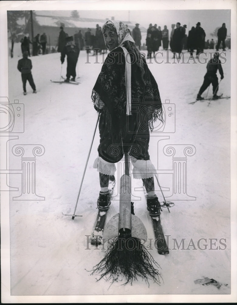 1953 Press Photo Costumed Witch With Jet Powered Broomstick on Skis, Germany - Historic Images