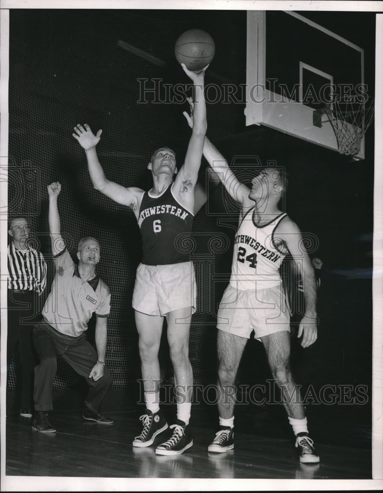 1955 Press Photo Dick Mast hacks teammate Glenn Rose in a basketball clinic - Historic Images