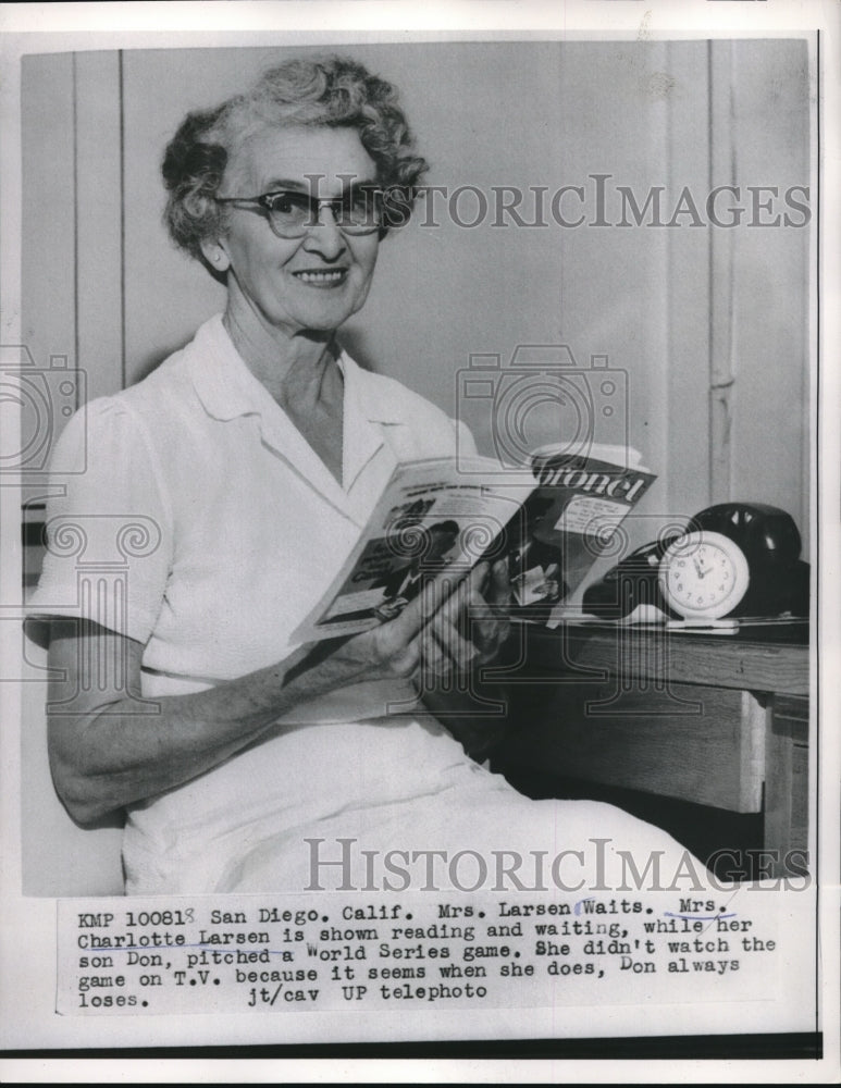 1956 Press Photo Mrs Charlotte Larsen Shown Reading While Son Don Pitches - Historic Images