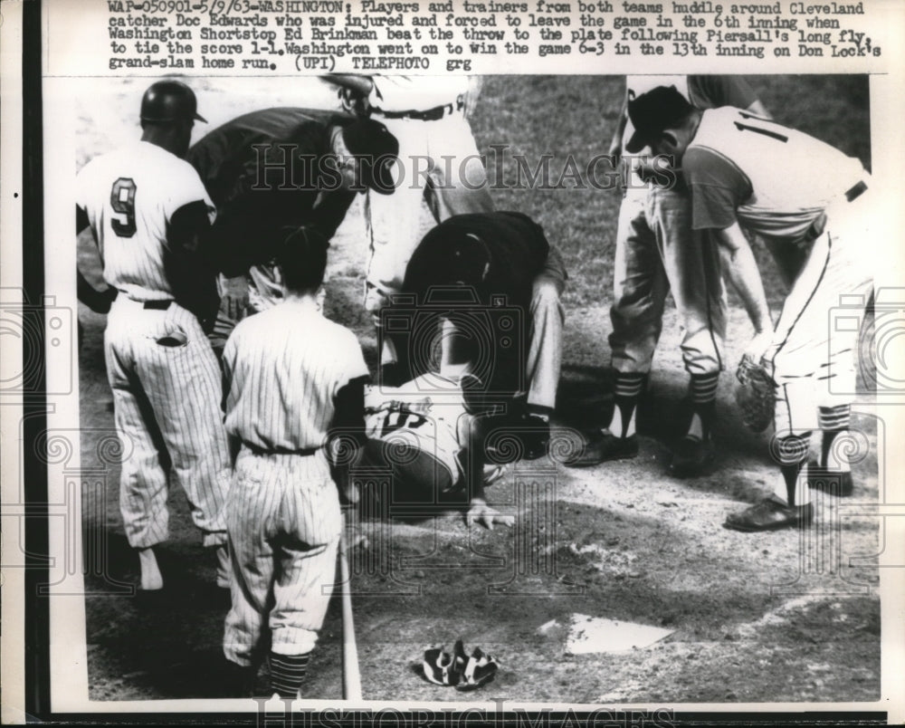 1963 Press Photo Indian catcher Doc Edwards injured by Senators Ed Brinkman - Historic Images