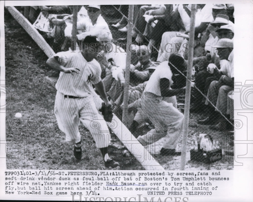 1956 Press Photo Red Sox Tom Umphlett vs Yankees Hank Bauer - nes18439 - Historic Images