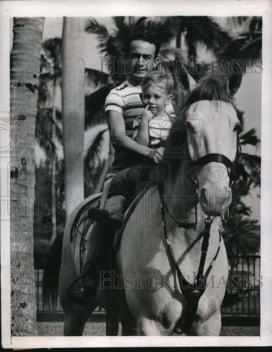 1948 Press Photo Miami Fla Jockey Ted Atkinson & son John out for a ride - Historic Images