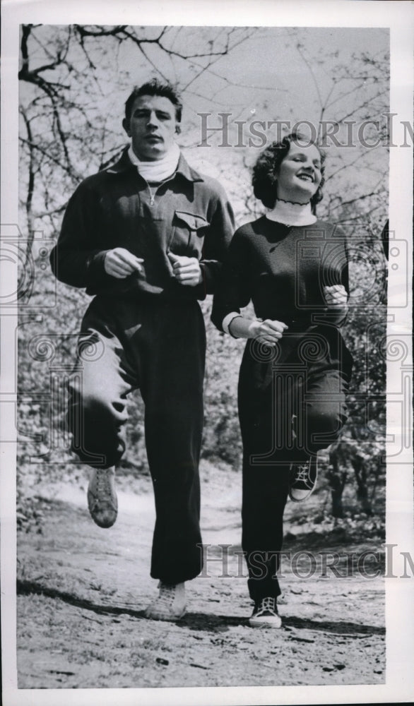 1954 Press Photo Mrs. Pierre Langlois exercises with her husband, Langlois - Historic Images