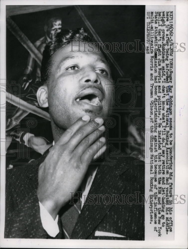 1959 Press Photo Sugar Ray Robinson seems to be pondering his future - nes28082- Historic Images