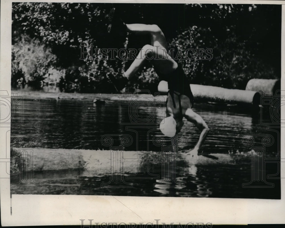 1939 Press Photo Longview Wash Betty Berkley handsprings on a floating log- Historic Images